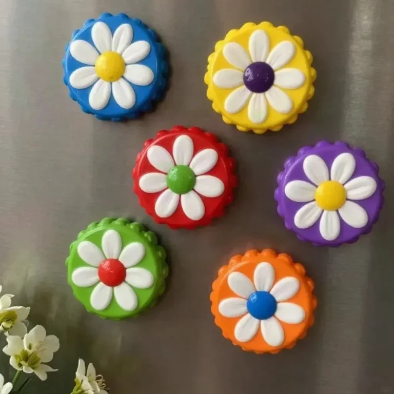Colorful DIY flower magnets made from recycled bottle caps.