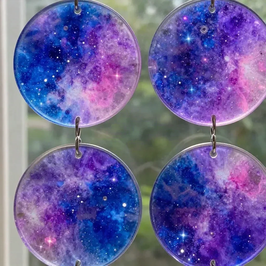DIY window art featuring galaxy bubble glue suncatchers colorful design