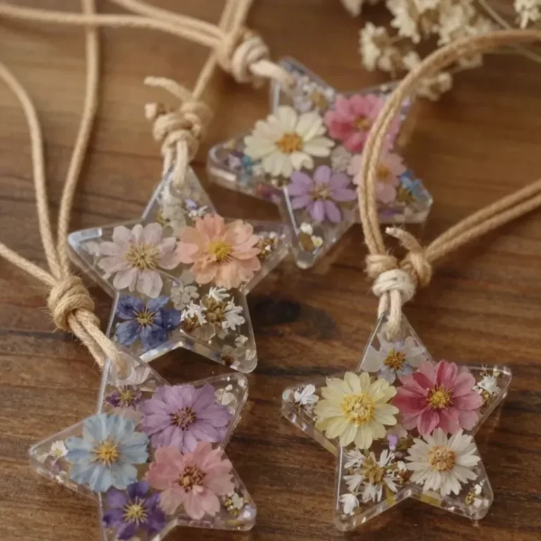 DIY pressed flower jewelry with star charms made from dried flowers