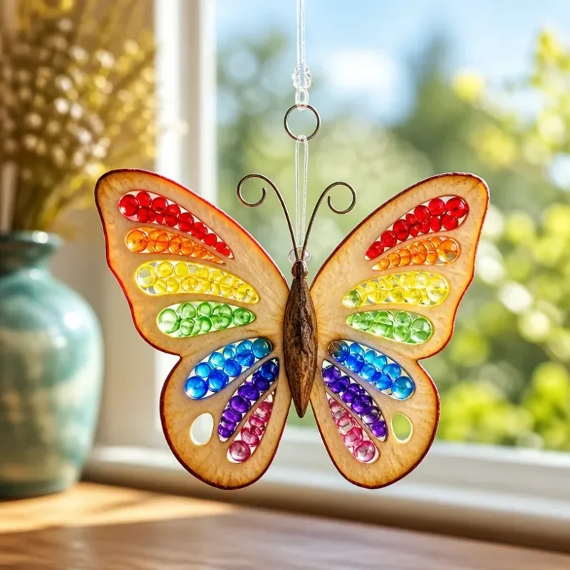 Rainbow Butterfly Suncatcher beautifully displayed in a window.