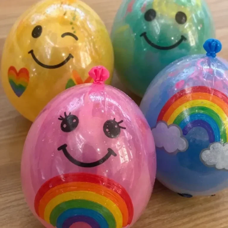 Colorful DIY rainbow yarn balloon squishies for creative crafting projects.