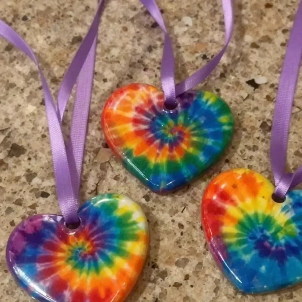 DIY swirled glue sun catchers hanging in a window