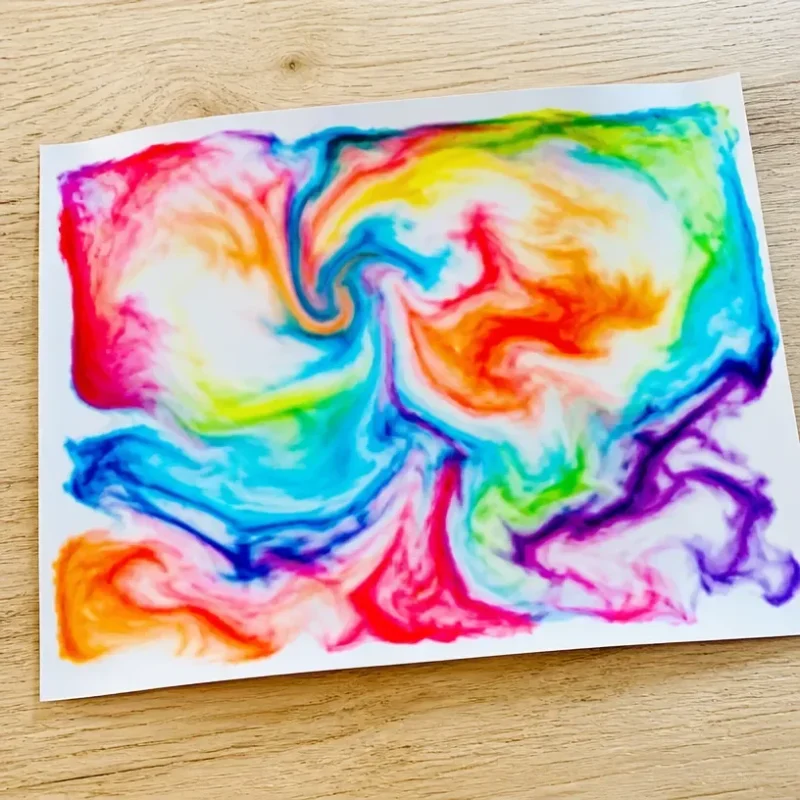 Colorful rainbow milk swirl print showcasing vibrant swirling patterns.
